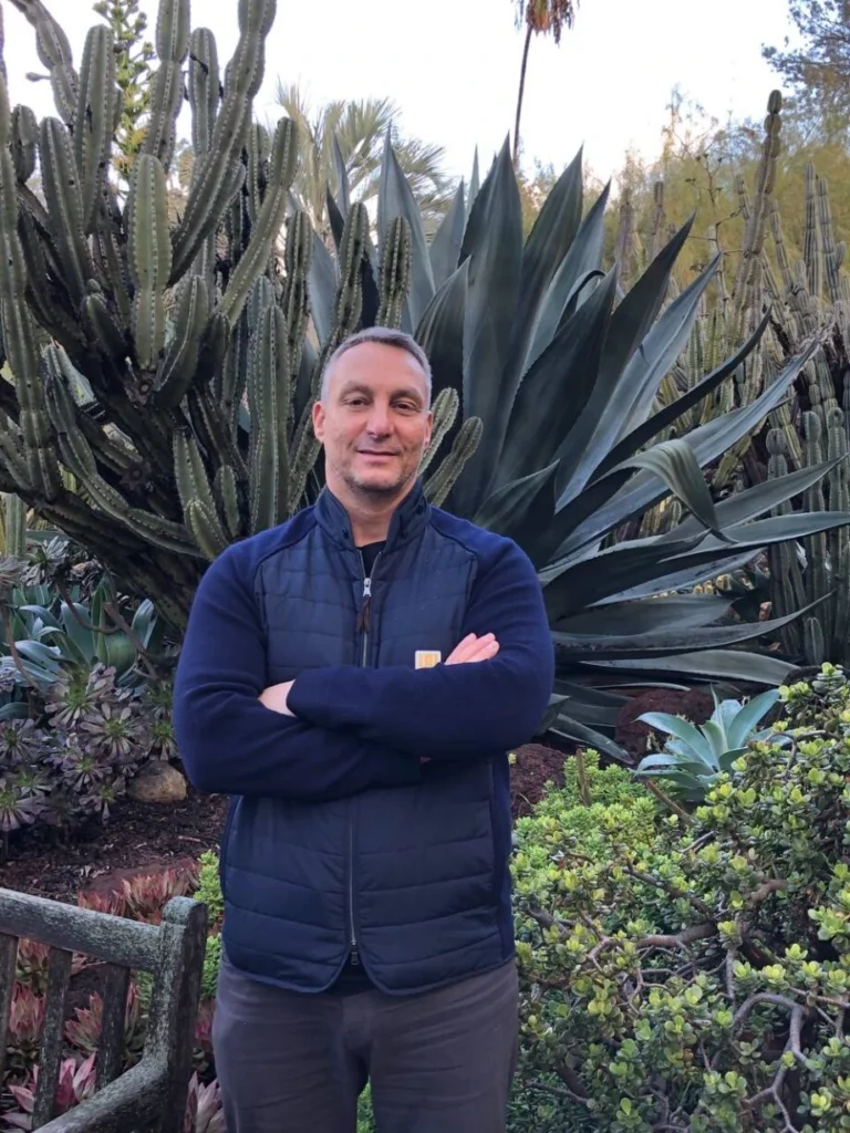 Photo of Terry standing in front of tree