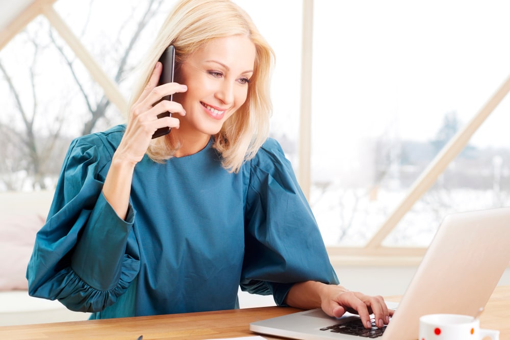 An ophthalmology office worker making a soft collections call An ophthalmology office worker making a soft collections call