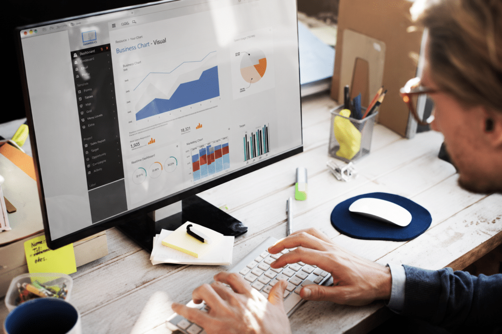 A man looking at a reporting dashboard